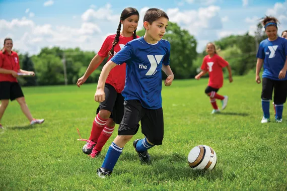 Youth playing soccer